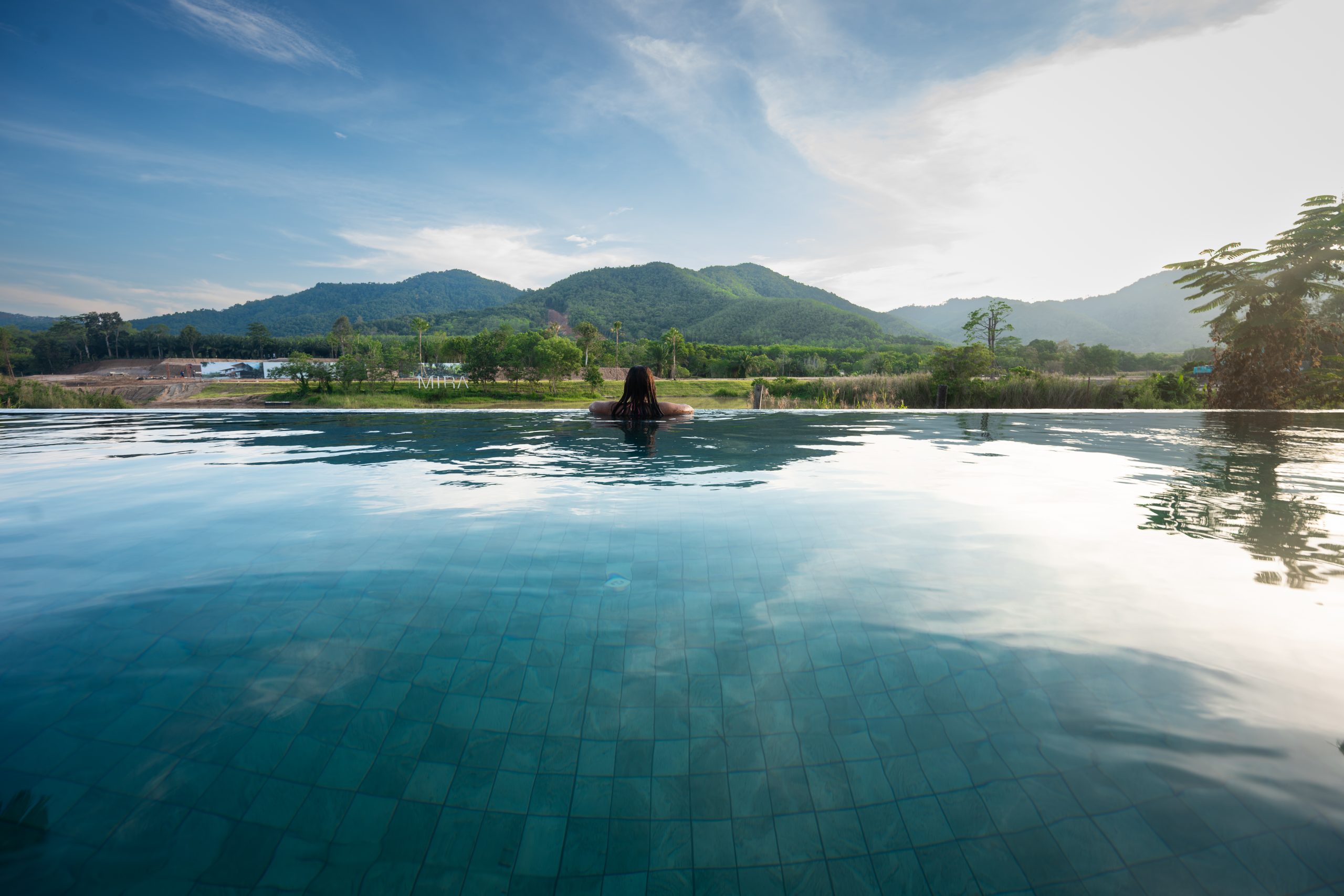 Swimming Swimming Pool with Lake and Mountain View